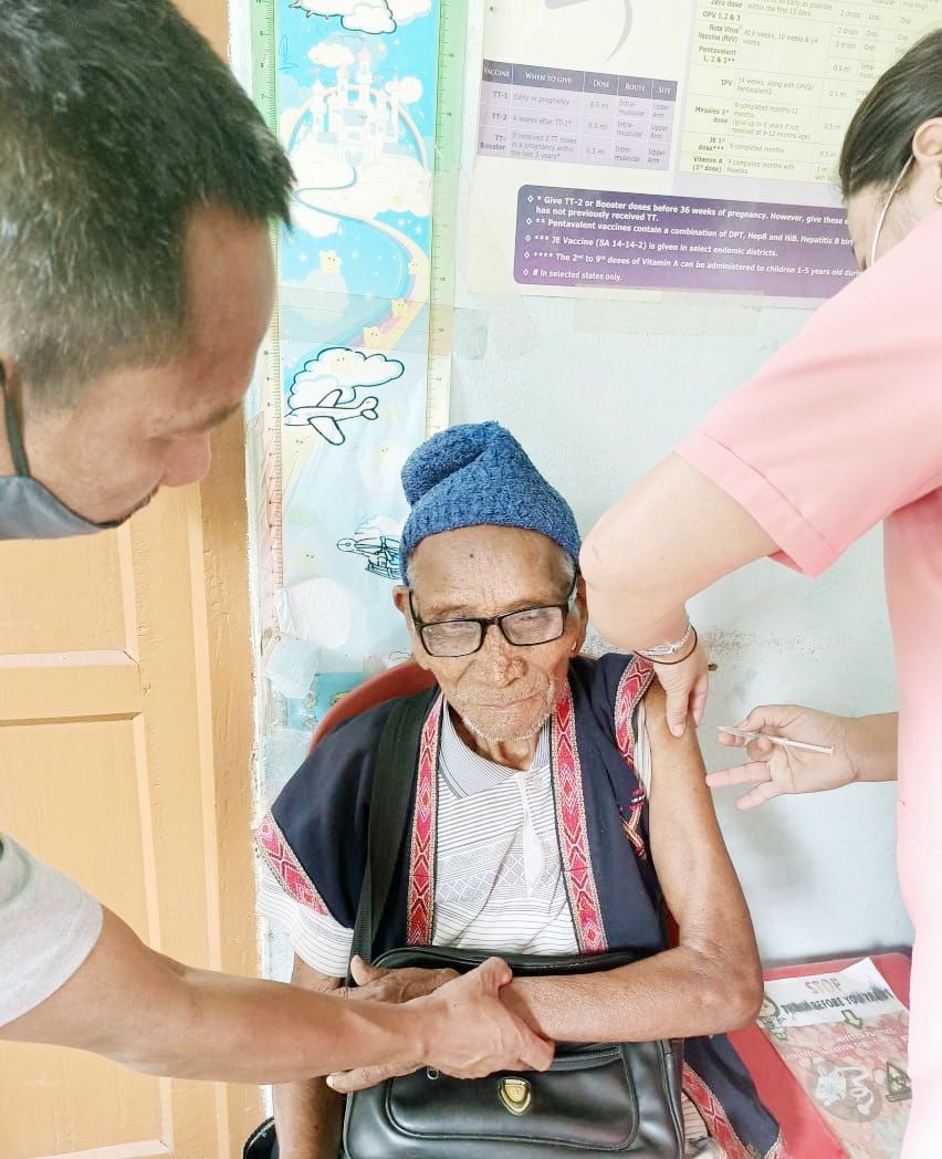 A 101-year old citizen of Mon getting the first dose of COVID-19 vaccine on April 22. (Photo Courtesy: CMO Mon)